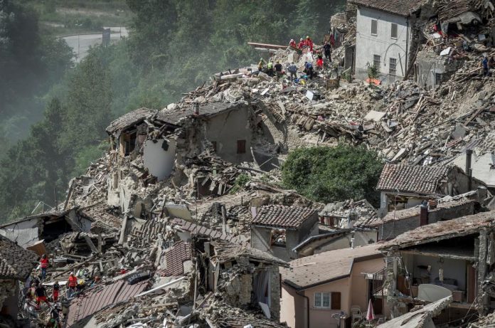Rescuers work following an earthquake in Pescara del Tronto